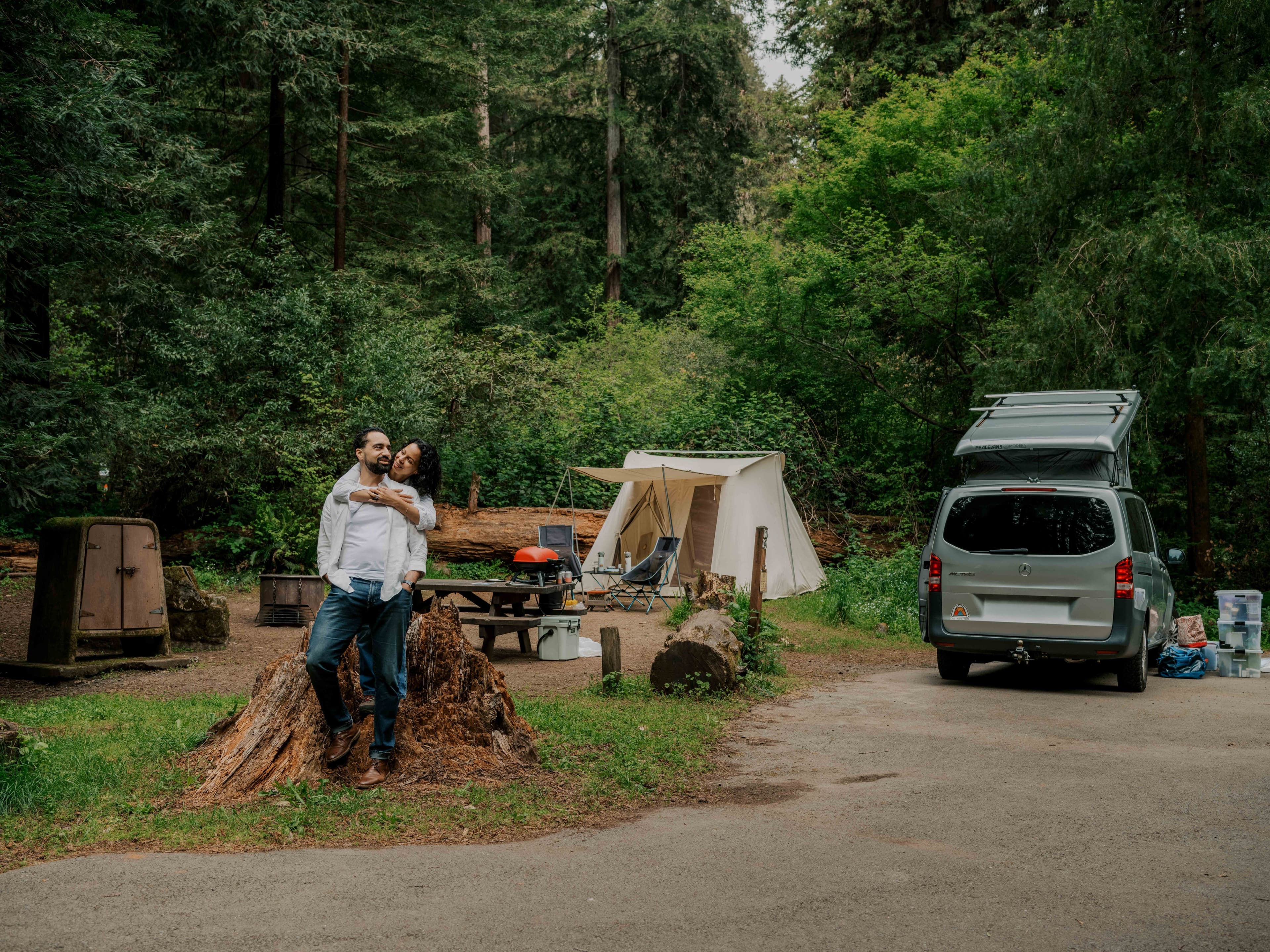 Justin and Sally at a scenic campground, standing together overlooking nature